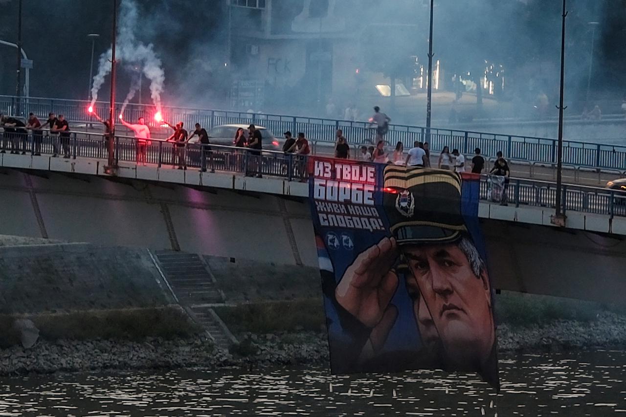 Supporters of the convicted Bosnian Serb general Ratko Mladic holds his picture in Novi Sad
