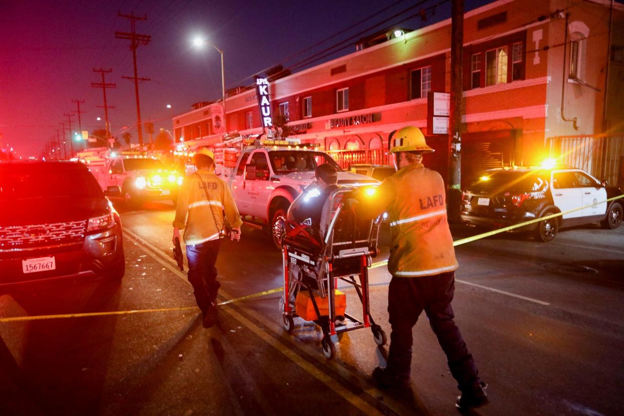 Members of the Los Angeles Fire Department work at the site of an explosion after police attempted to safely detonate illegal fireworks that were seized, in Los Angeles