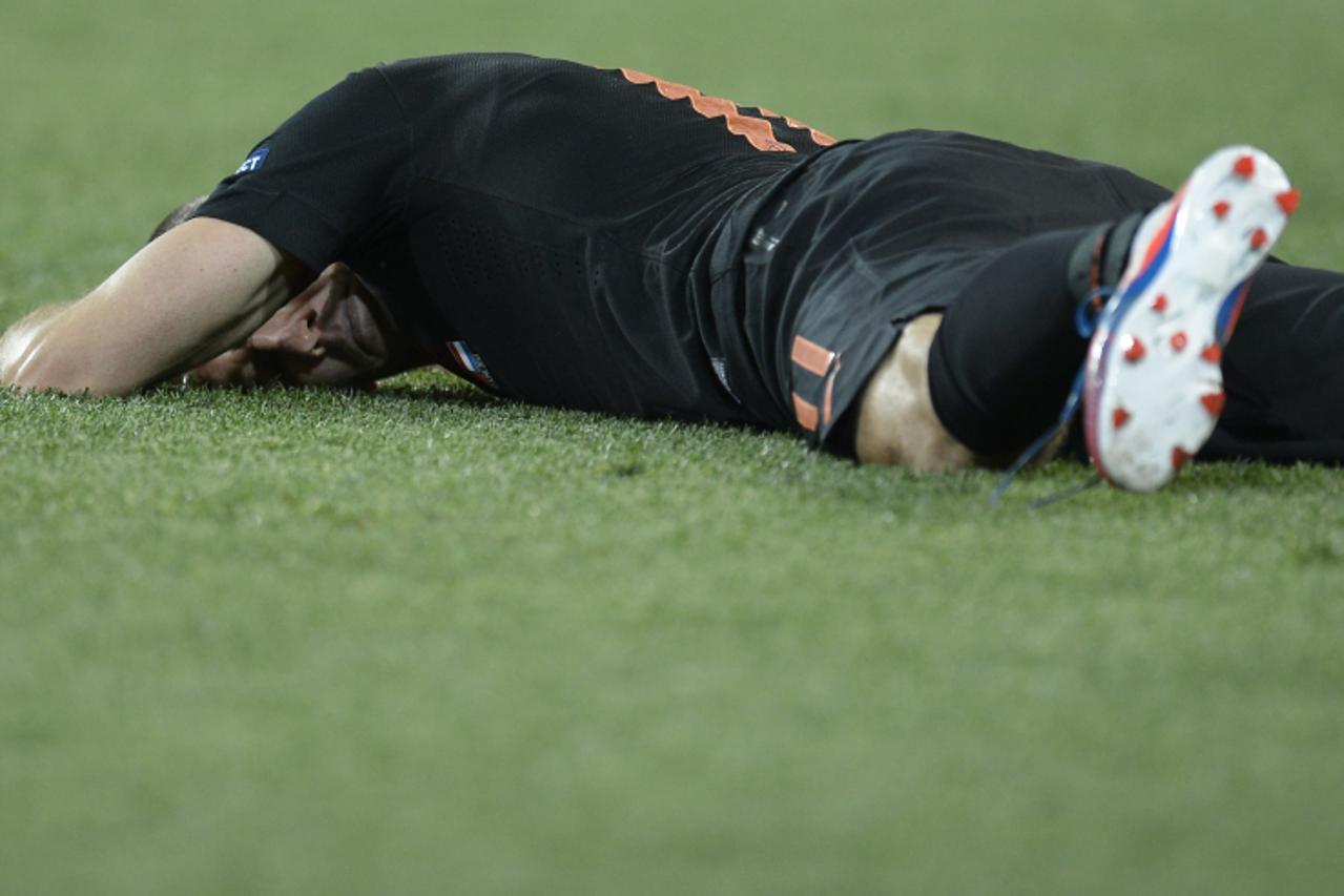 'Dutch midfielder Arjen Robben lays on the pitch during the Euro 2012 football championships match Portugal vs. Netherlands, on June 17, 2012 at the Metalist stadium in Kharkiv. Portugal won 2 to 1.  