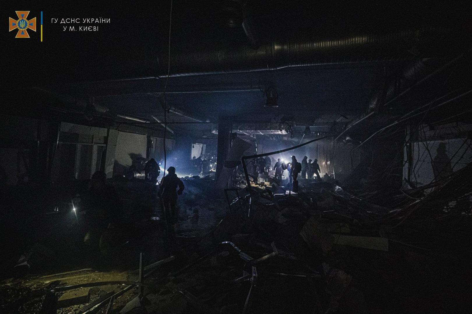 Rescuers work at the site of a shopping mall damaged by an airstrike, as Russia's attack on Ukraine continues, in Kyiv, Ukraine, in this handout picture released March 21, 2022.  Press service of the State Emergency Service of Ukraine/Handout via REUTERS ATTENTION EDITORS - THIS IMAGE HAS BEEN SUPPLIED BY A THIRD PARTY. Photo: State Emergency Service/REUTERS