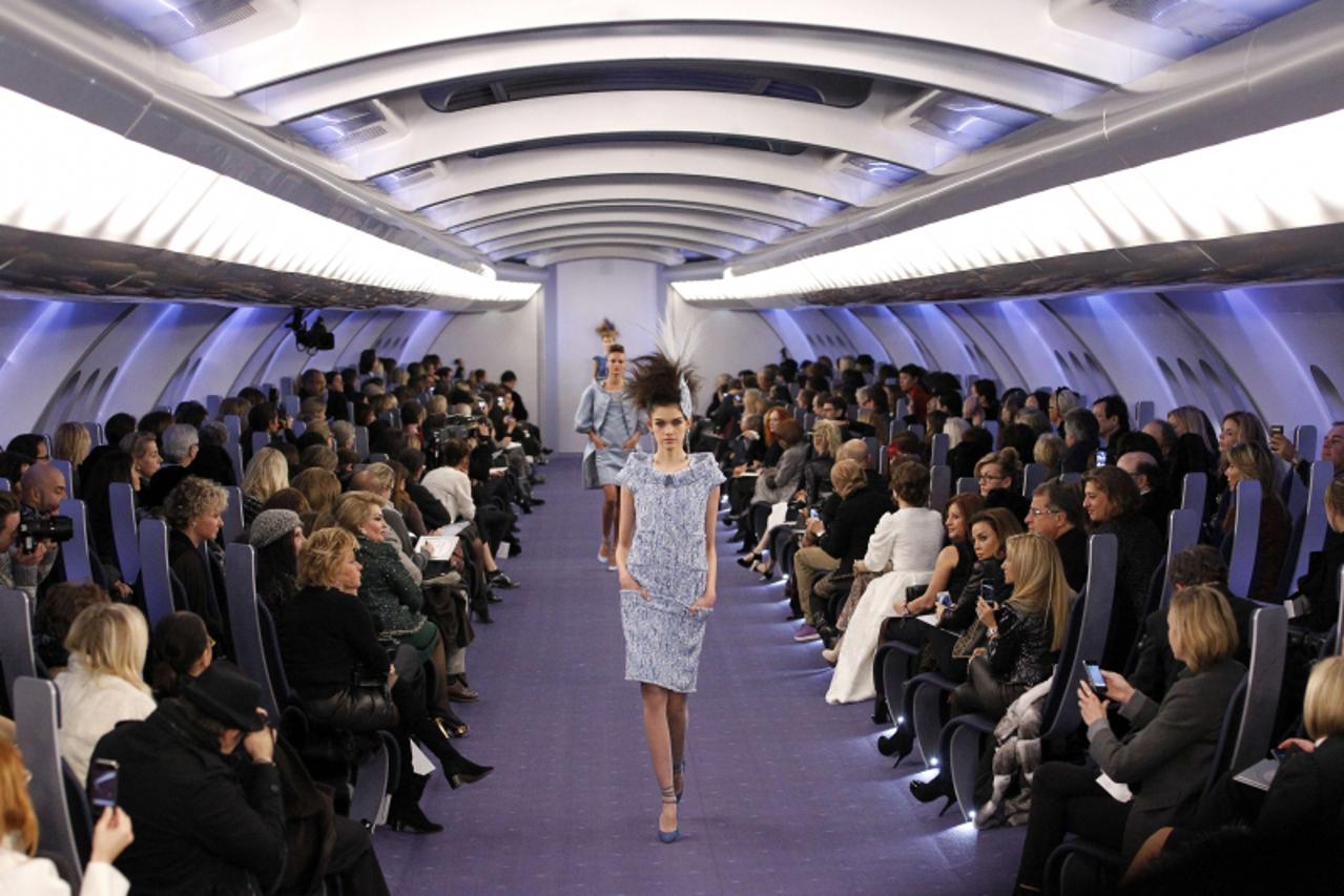 'A model presents a creation by German designer Karl Lagerfeld for Chanel during the Spring/Summer 2012 Haute Couture collection show, on January 24, 2012 at the Grand Palais in Paris. AFP PHOTO/ALEXA