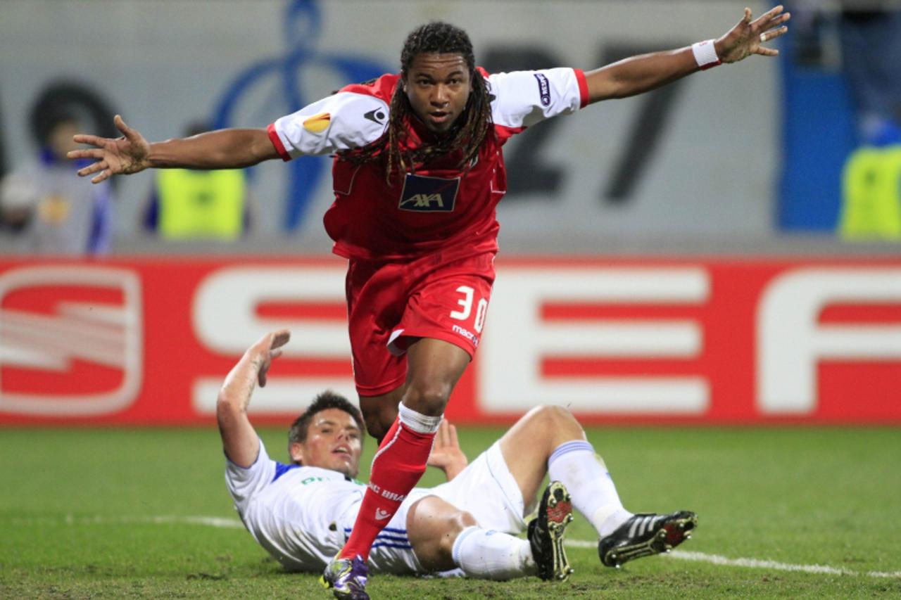 'Alan of Braga celebrates after Ognjen Vukojevic of Dinamo Kiev (back) scored an own goal during their Europa League quarter-final first leg match at the Valeriy Lobanovskiy Stadium in Kiev April 7, 2