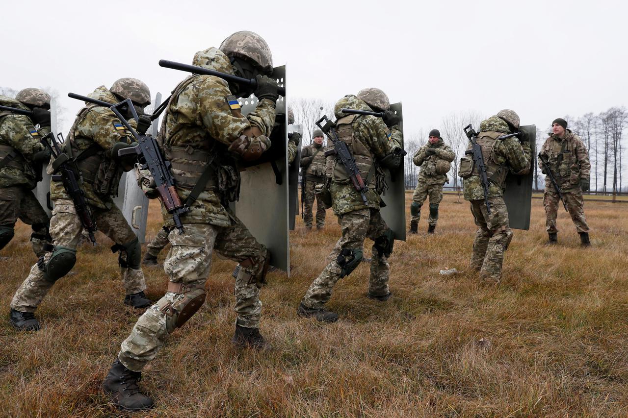 Members of the Ukrainian State Border Guard Service attend a training session near the border with Belarus and Poland in Volyn region