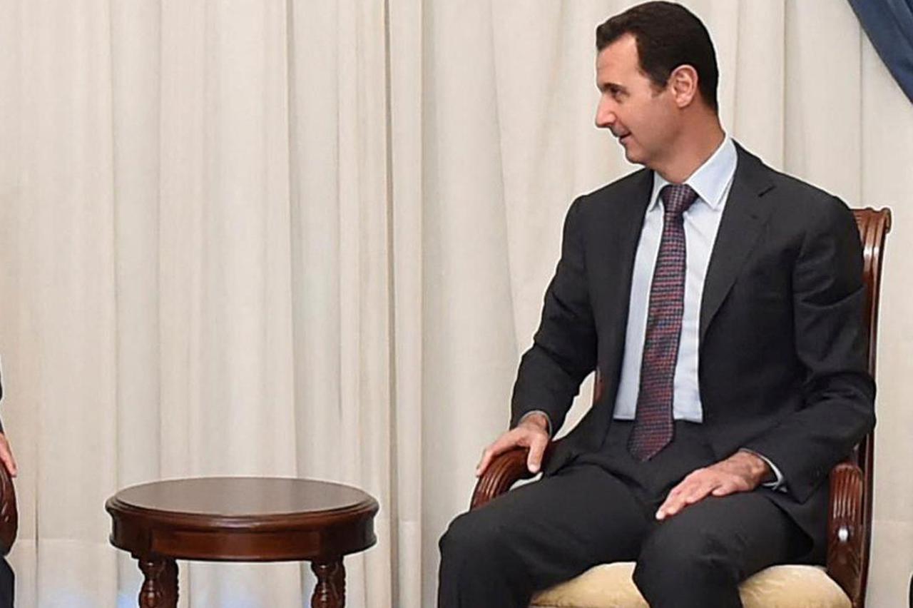 FILE PHOTO: Syria's President Bashar al-Assad meets Admiral Ali Shamkhani, Iran?s Supreme National Security Council Director, in Damascus