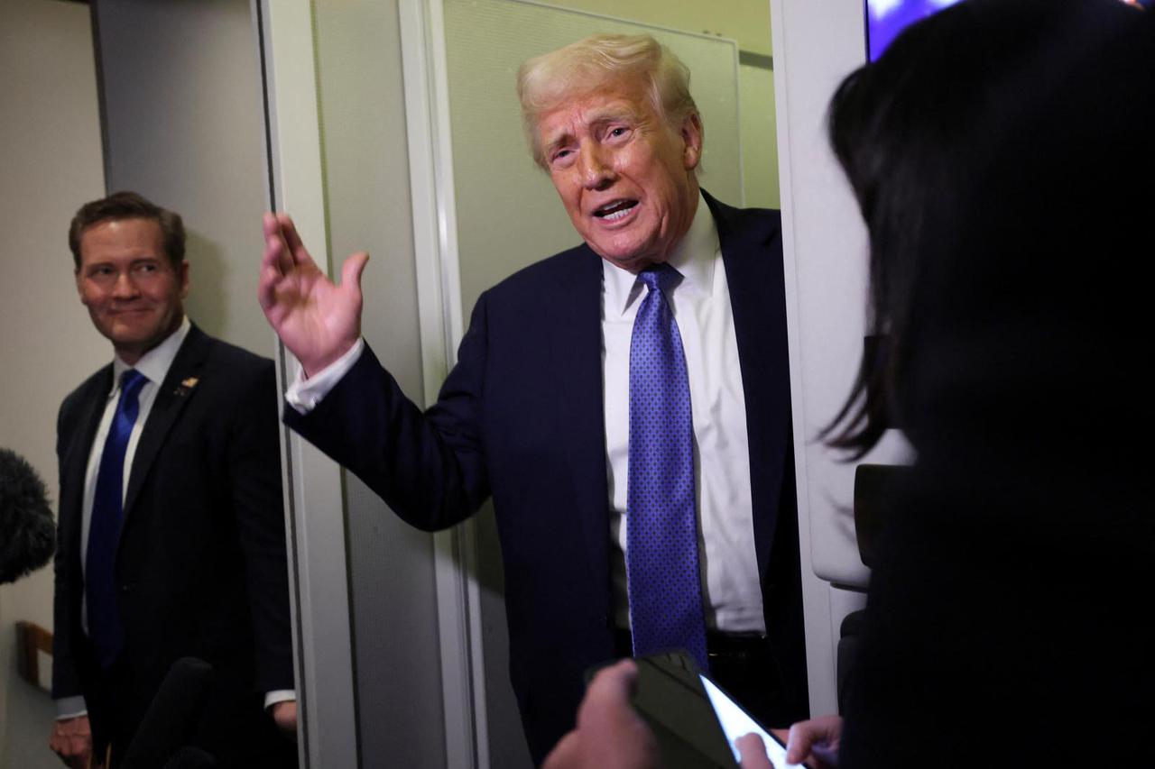U.S. President Trump speaks to reporters on his return to Washington