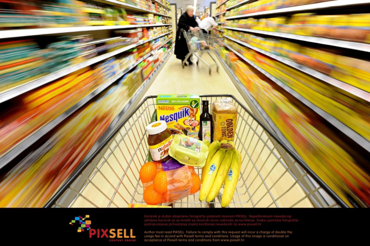 'A†shopping cart is pushed through a supermarket in Muelheim Ruhr, Germany, 10 January 2011. Groceries prices might continue rising, according to estimations made by the industry. Prices for staple fo