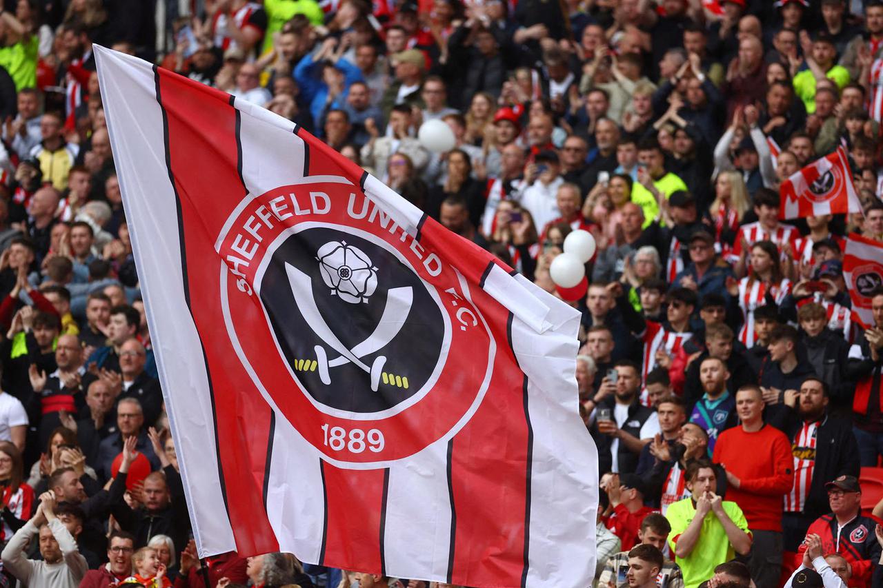FILE PHOTO: Sheffield United fans hold up a flag during the 2023 FA Cup semi-final against Manchester Ciityeffield United