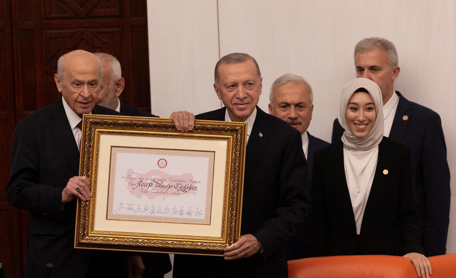 Turkish President Tayyip Erdogan receives his election mandate from Devlet Bahceli, speaker of the Parliament and leader of Nationalist Movement Party (MHP), takes oath after his election win at the parliament in Ankara, Turkey, June 3, 2023. REUTERS/Umit Bektas Photo: UMIT BEKTAS/REUTERS