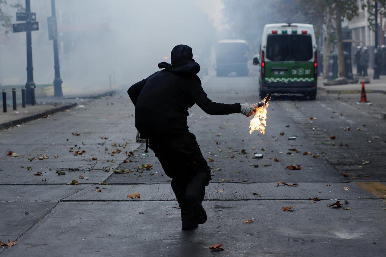 Chilean workers march to mark the International Workers Day, in Santiago