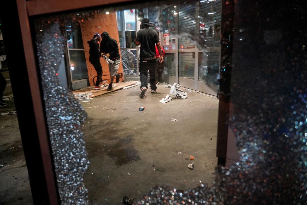 People loot property during nationwide unrest following the death in Minneapolis police custody of George Floyd, in Los Angeles