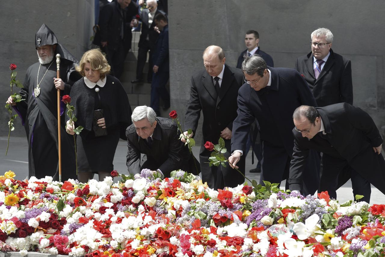 (L-R) Catholicos Karekin II, the supreme head of the Armenian Apostolic Church, Armenia's President Serzh Sargsyan together with his wife Rita, Russia's President Vladimir Putin, Cyprus President Nicos Anastasiades and France's President Francois Hollande