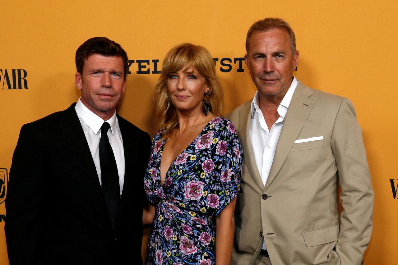 FILE PHOTO: Creator, director and executive producer Sheridan poses with cast members Costner and Reilly at a premiere for the television series "Yellowstone" in Los Angeles