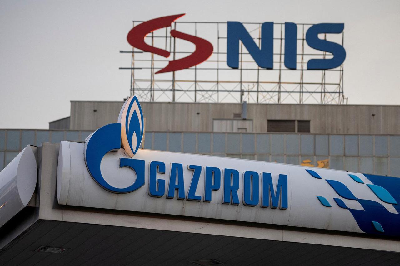 FILE PHOTO: Signages display the logos of NIS as well as Russian oil producer Gazprom Neft, in Belgrade