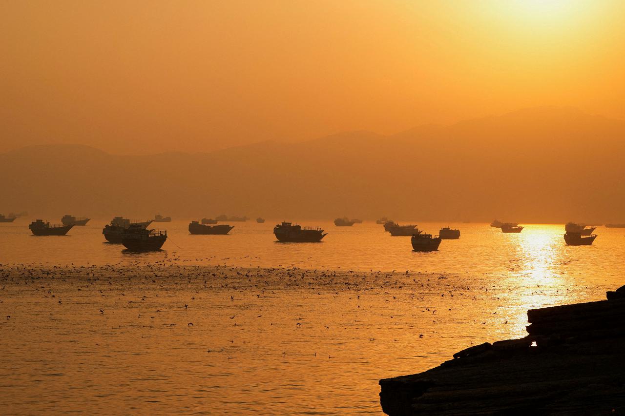 FILE PHOTO: Vessels at the Strait of Hormuz, as seen from Musandam