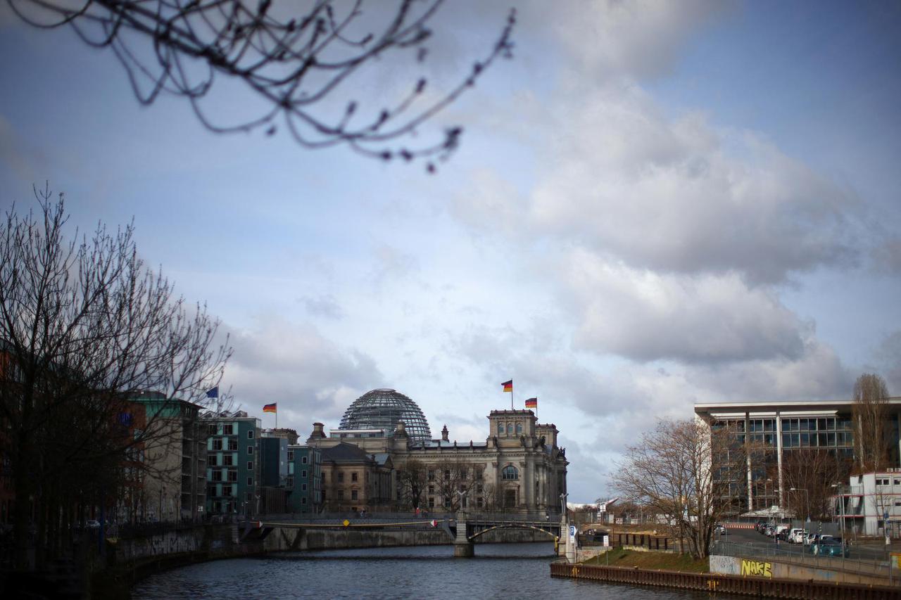 The Reichstag building is seen on the banks of Spree river in Berlin