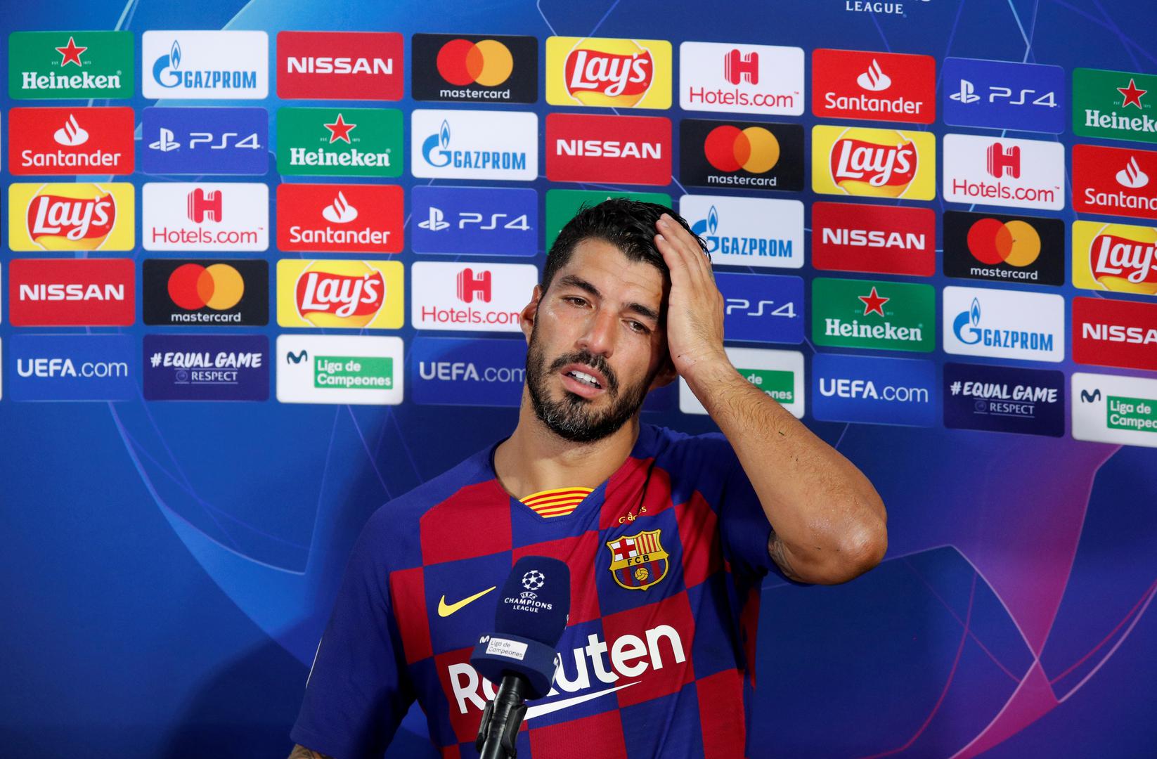 FILE PHOTO: Champions League - Round of 16 Second Leg - FC Barcelona v Napoli FILE PHOTO: Soccer Football - Champions League - Round of 16 Second Leg - FC Barcelona v Napoli - Camp Nou, Barcelona, Spain - August 8, 2020  Barcelona's Luis Suarez speaks to the media after the match, as play resumes behind closed doors following the outbreak of the coronavirus disease (COVID-19)  REUTERS/Albert Gea/File Photo ALBERT GEA