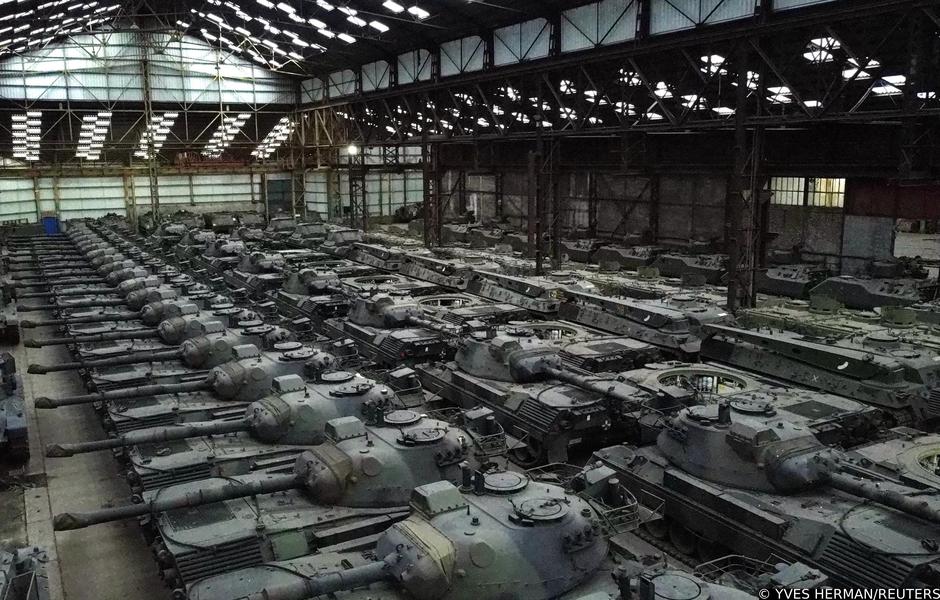 Dozens of German-made Leopard 1 tanks are seen in an hangar in Tournais