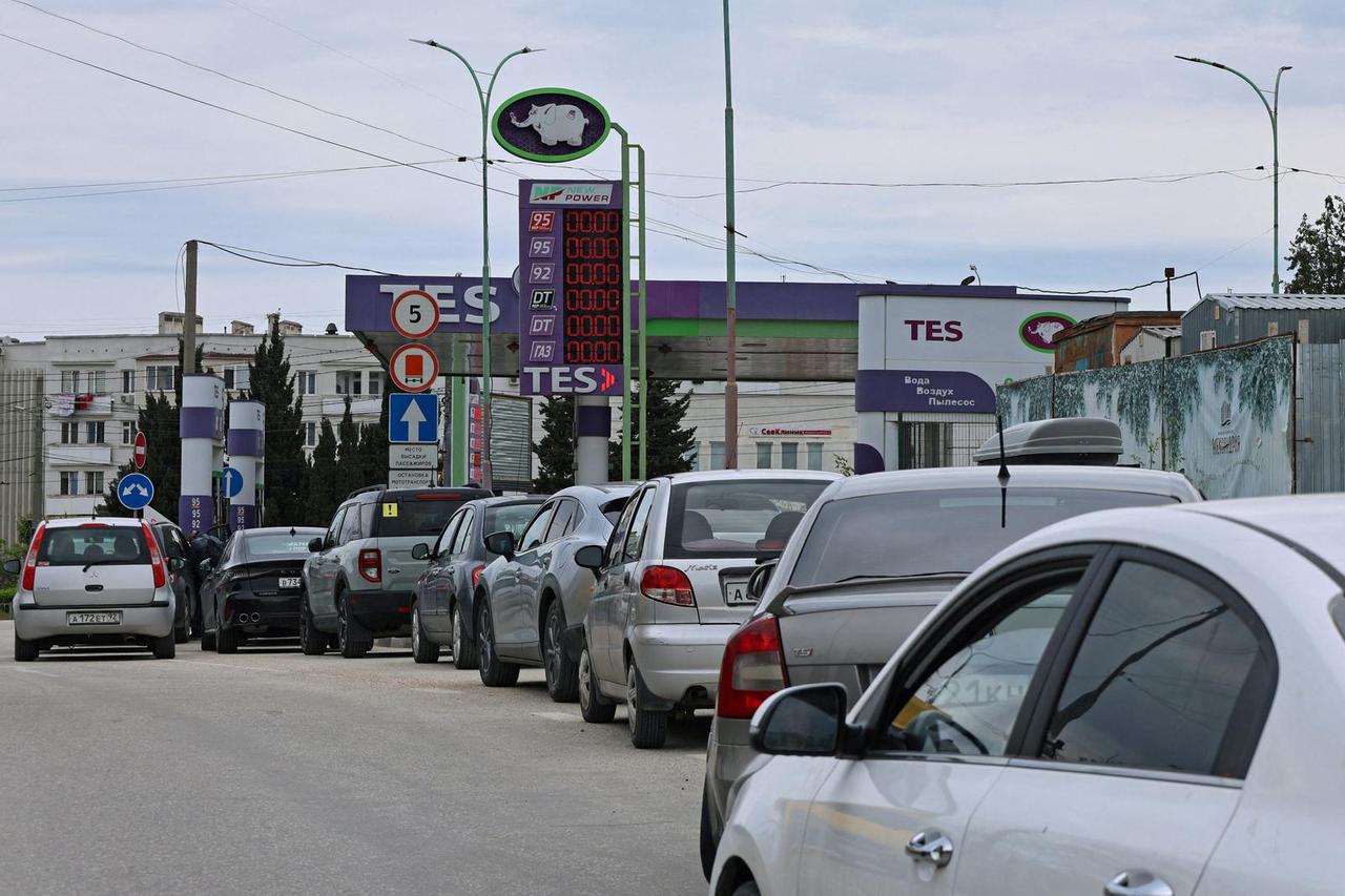 FILE PHOTO: Cars queue for fuel at a gas station in Sevastopol