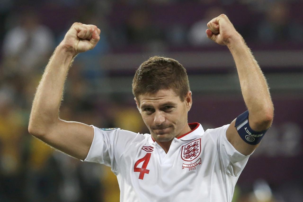 'England's Steven Gerrard celebrates victory over Ukraine after their Group D Euro 2012 soccer match at the Donbass Arena in Donetsk, June 19, 2012.    REUTERS/Alessandro Bianchi (UKRAINE  - Tags: SP