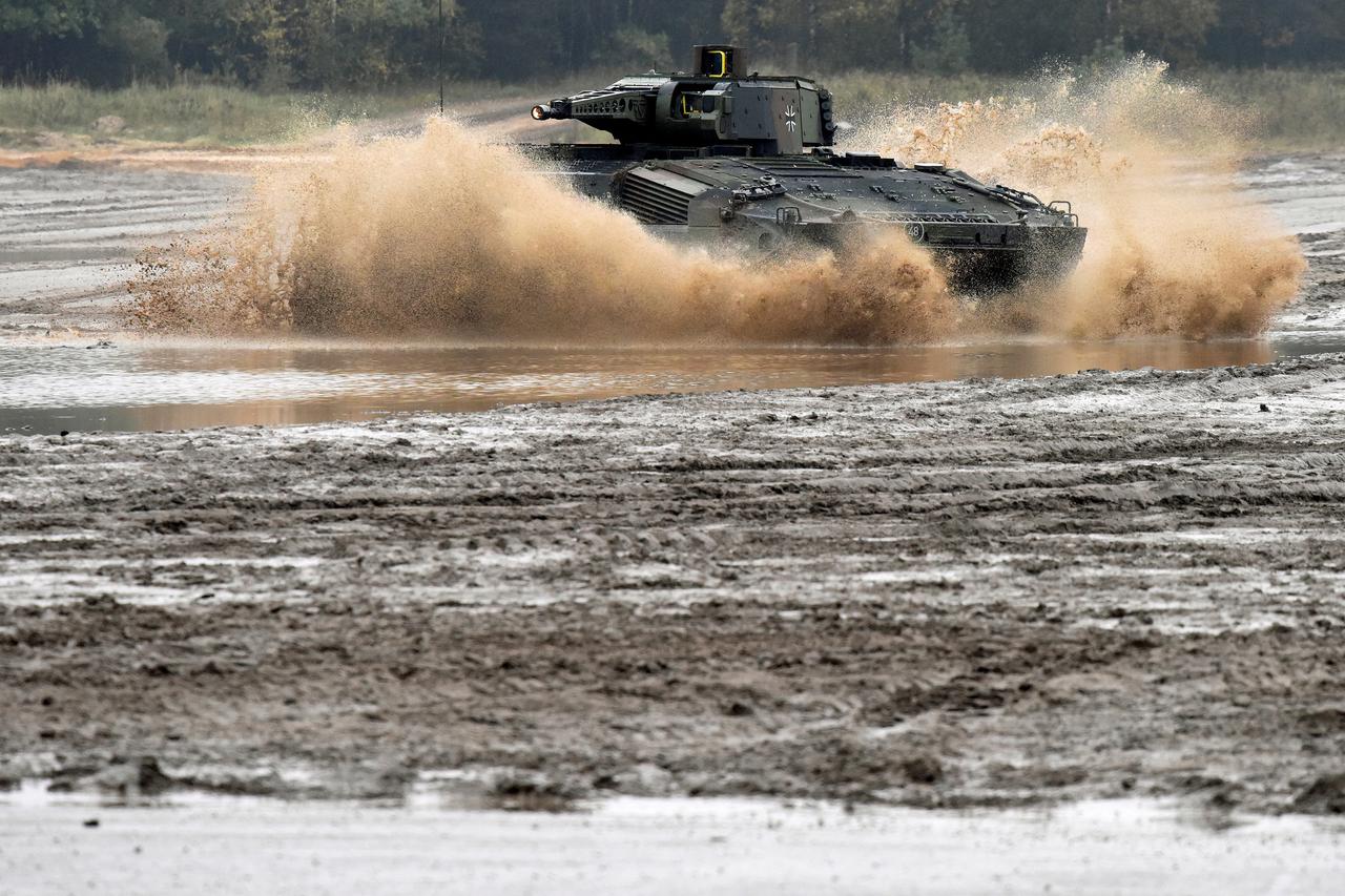 A Puma infantry fighting vehicle crosses a river during a German army, the Bundeswehr, training and information day in Munster