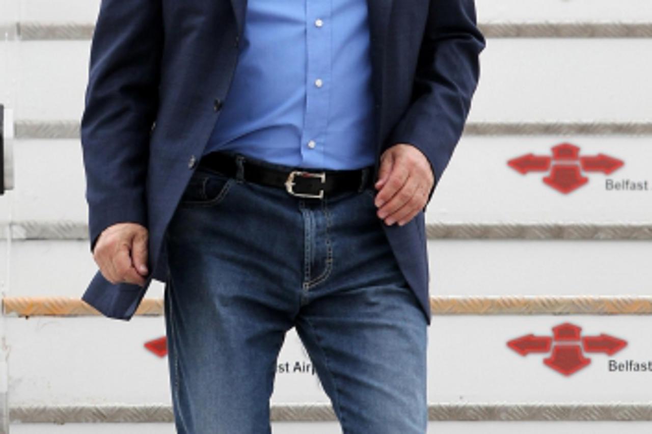 'Russia\'s President Vladimir Putin arrives to attend the Enniskillen G8 summit, at Belfast International Airport, in Northern Ireland June 17, 2013. At the G8 Summit being held in the Lough Erne golf