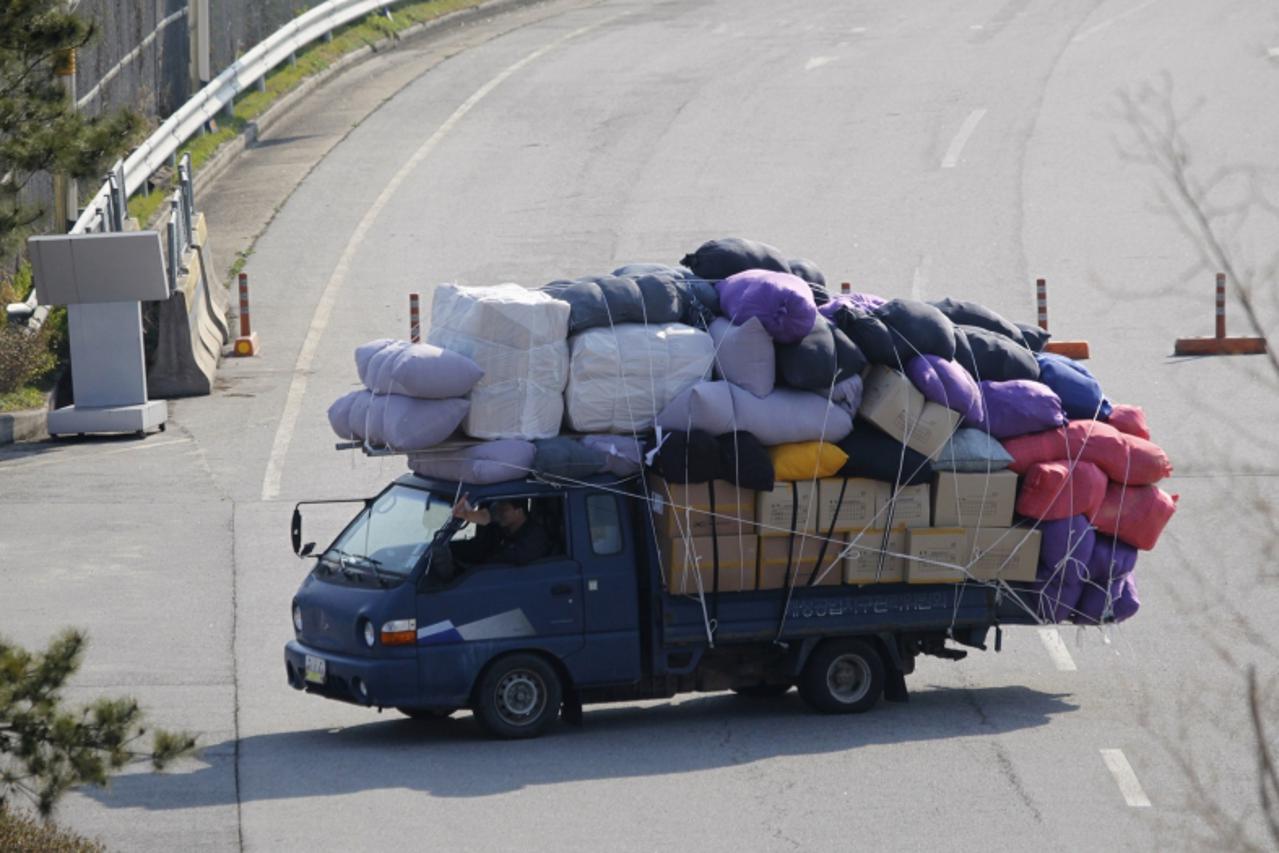 'A truck of a South Korean company carrying products made in inter-Korean Kaesong Industrial Complex in North Korea, arrives at the customs, immigration and quarantine (CIQ) office, just south of the 