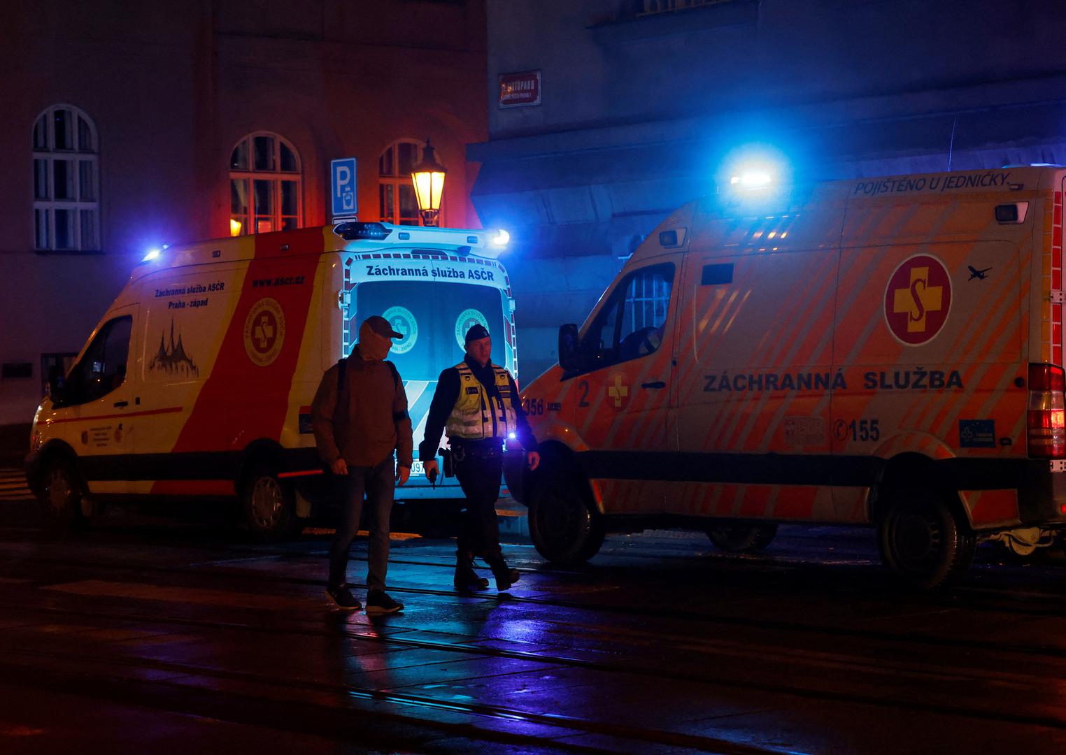 Police officers walk past ambulances parked near the area of the shooting at one of the buildings of Charles University in Prague, Czech Republic, December 21, 2023. REUTERS/David W Cerny Photo: DAVID W CERNY/REUTERS