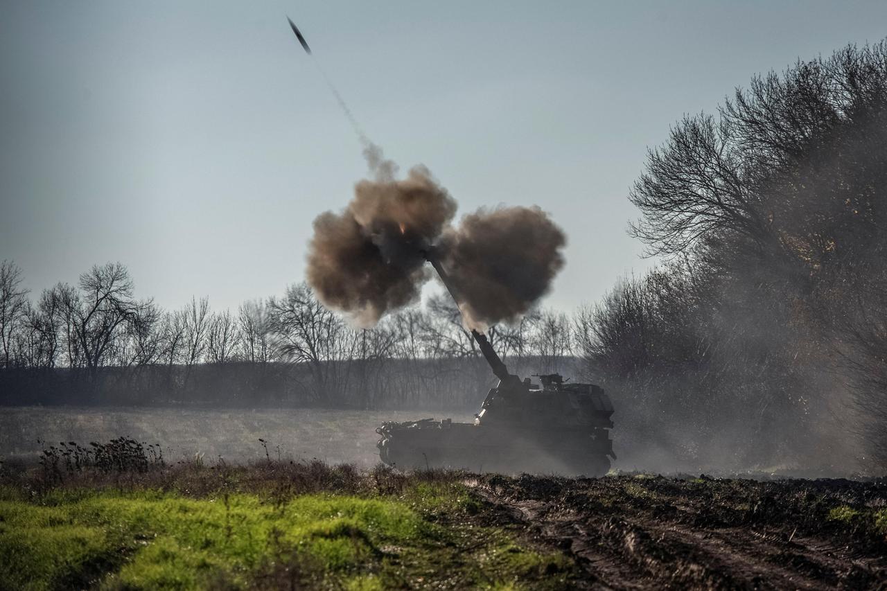 Ukrainian servicemen fire a Polish self-propelled howitzer Krab toward Russian positions in Donetsk region