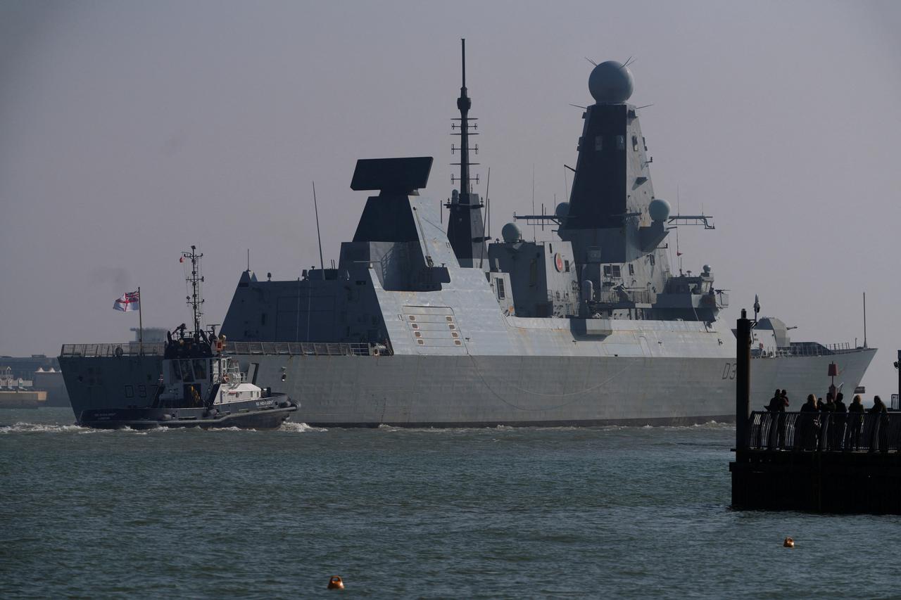 British Royal Navy destroyer HMS Duncan sails as it leaves Portsmouth Harbour
