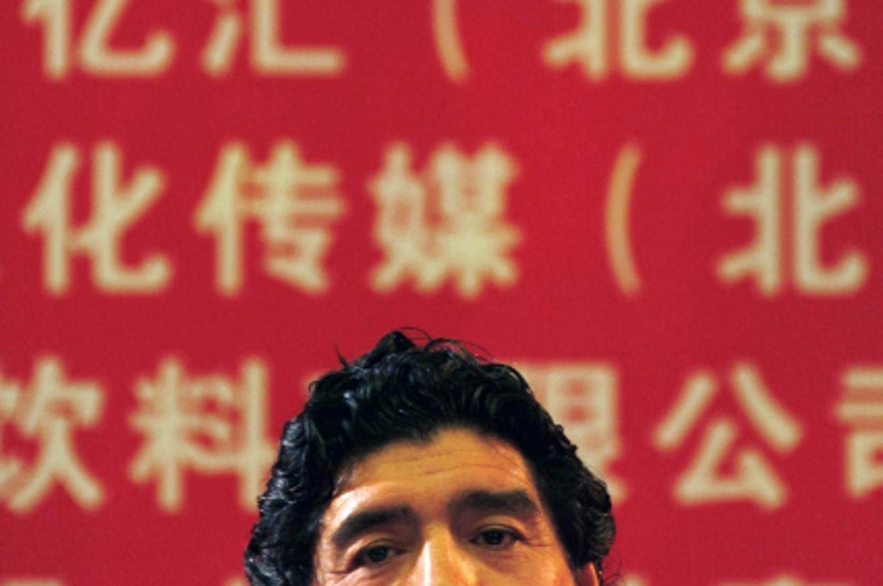 'Former player and coach of Argentina\'s soccer team Diego Maradona listens during an official function for the Chinese Red Cross Foundation in Beijing November 4, 2010. Maradona is visiting China to 