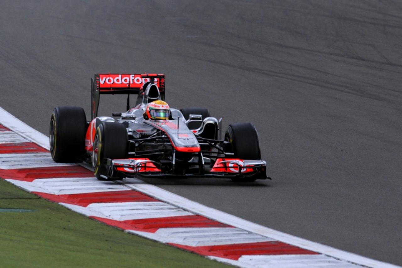 'McLaren Mercedes\' British driver Lewis Hamilton drives at the Nurburgring racetrack on July 24, 2011 in Nurburg during the German Formula One Grand Prix. AFP PHOTO / PATRIK STOLLARZ'