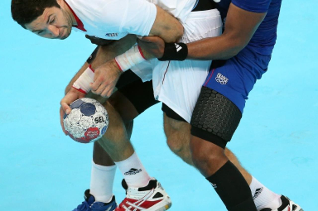 '10.08.2012., London, Engleska - Ljetne Olimpijske igre, rukomet, polufinale. Francuska - Hrvatska. Sorhaindo Cedric, Blazenko Lackovic. Photo: Igor Kralj/PIXSELL'