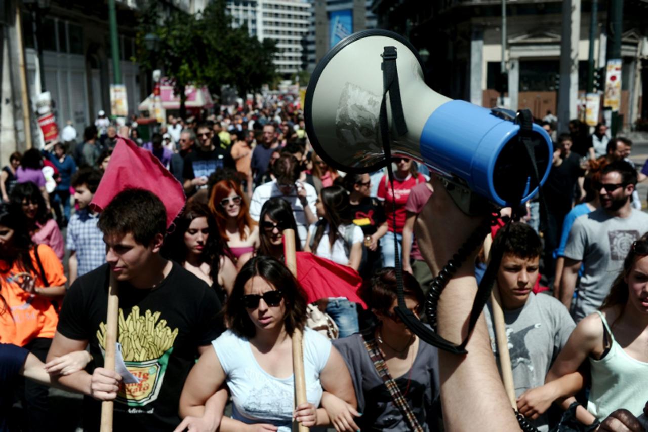 'Protesters march in central Athens to mark the May-day celebrations on May 1, 2012.  More than 18,000 people took to the streets of cities around debt-stricken Greece  to join traditional May 1 labou