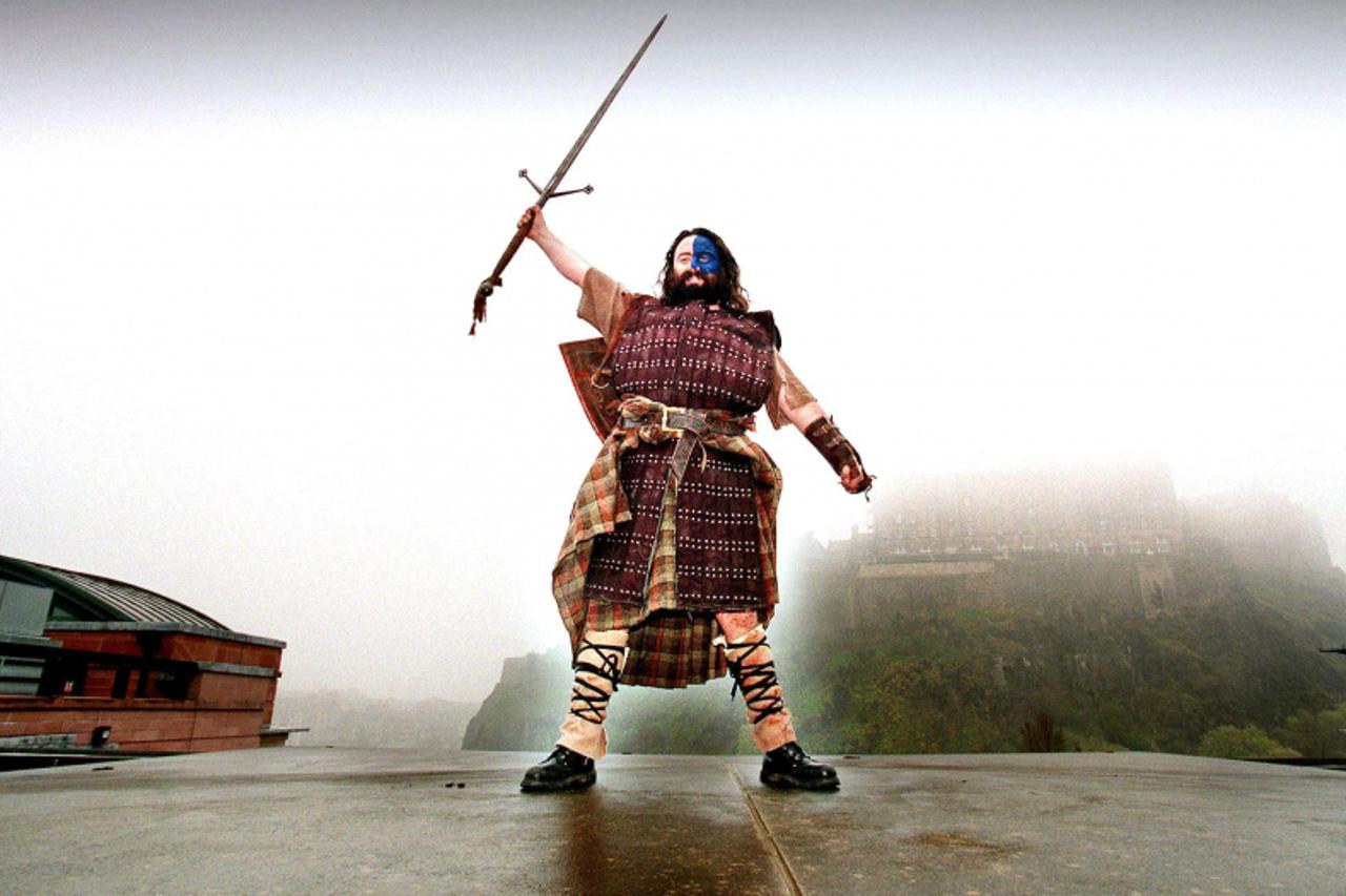 'Undated filer of Independent candidate in the Scottish Parliamentary elections, William Wallace, launching his manifesto from the roof of Saltire Court, Edinburgh, as the Scottish elections scheduled