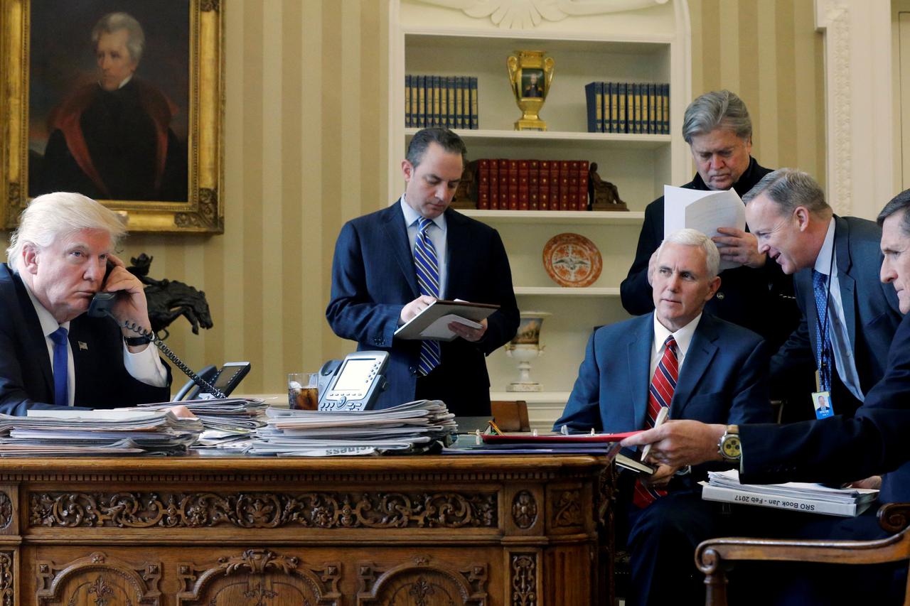 U.S. President Donald Trump (L-R), joined by Chief of Staff Reince Priebus, Vice President Mike Pence, senior advisor Steve Bannon, Communications Director Sean Spicer and National Security Advisor Michael Flynn, speaks by phone with Russia's President Vl