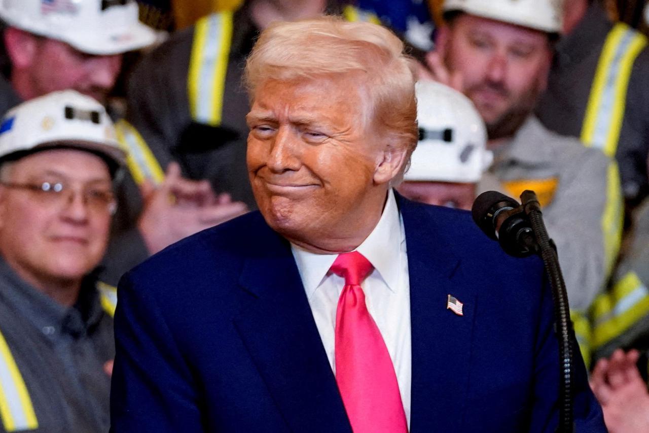 FILE PHOTO: U.S. President Donald Trump signs executive orders in Washington