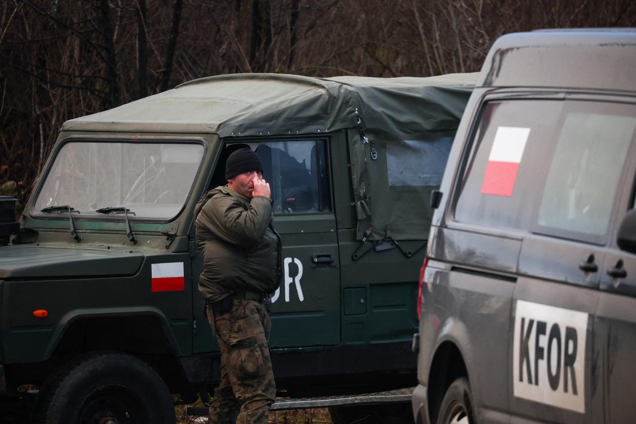 Kosovo police officers patrol an area in the northern part of the ethnically-divided town of Mitrovica