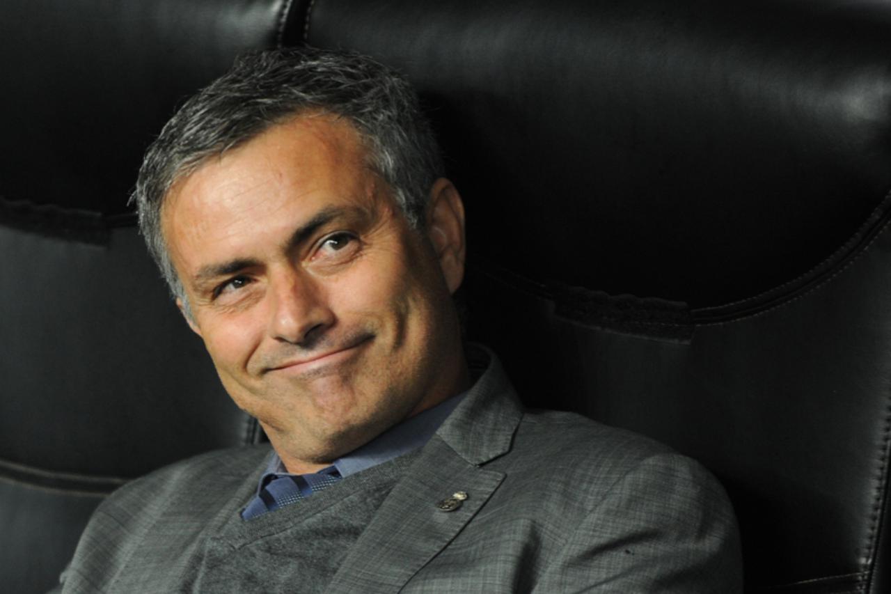 'Real Madrid\'s Portuguese coach Jose Mourinho smiles before his team\'s Champions League group G football match against AC Milan on November 3, 2010 at San Siro Stadium in Milan.  AFP PHOTO / GIUSEPP