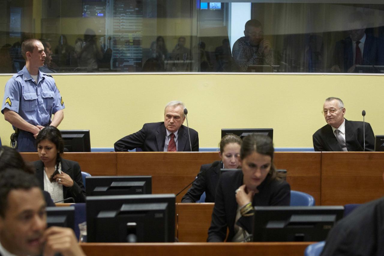 'Franko Simatovic (top R), former commander of the Special Operations Unit of the Serbian State Security Service, and Jovica Stanisic (top C), former chief of Serbian State Security, sit in the courtr