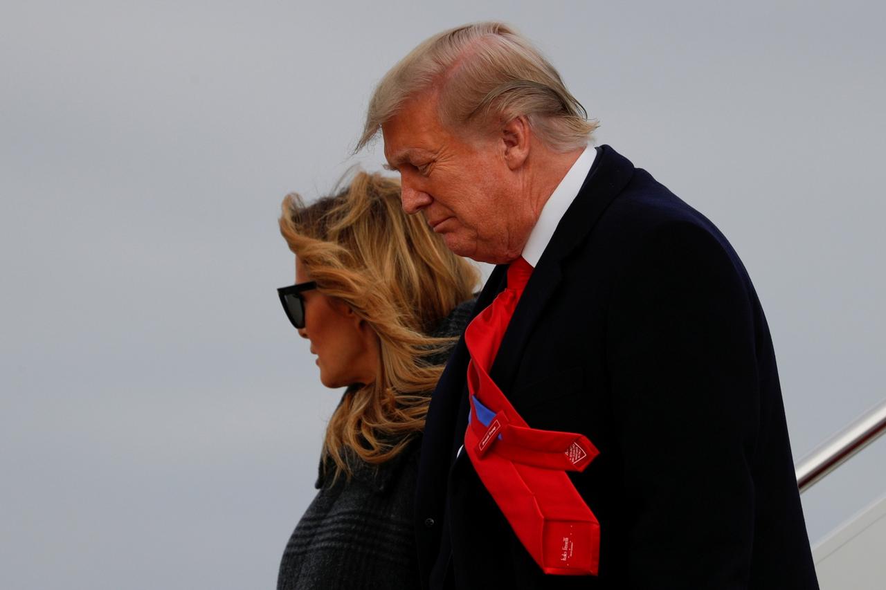 President Trump and first lady Melania Trump descend from Air Force One at Joint Base Andrews in Maryland