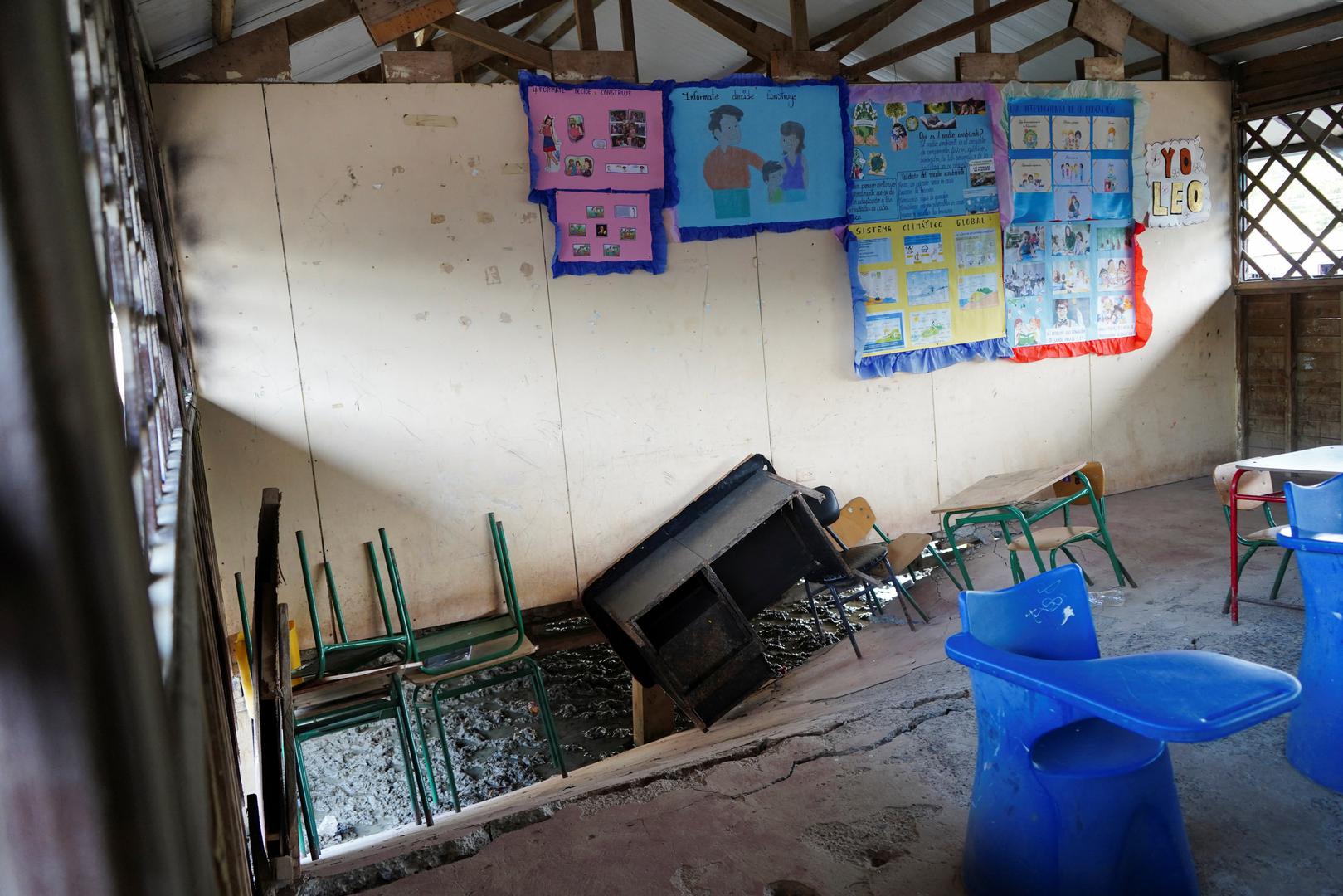 A table and chairs are seen in a hole in the floor of a school following an earthquake in Isla Puna, Ecuador March 18, 2023. REUTERS/Maria Fernanda Landin Photo: MARIA FERNANDA LANDIN/REUTERS