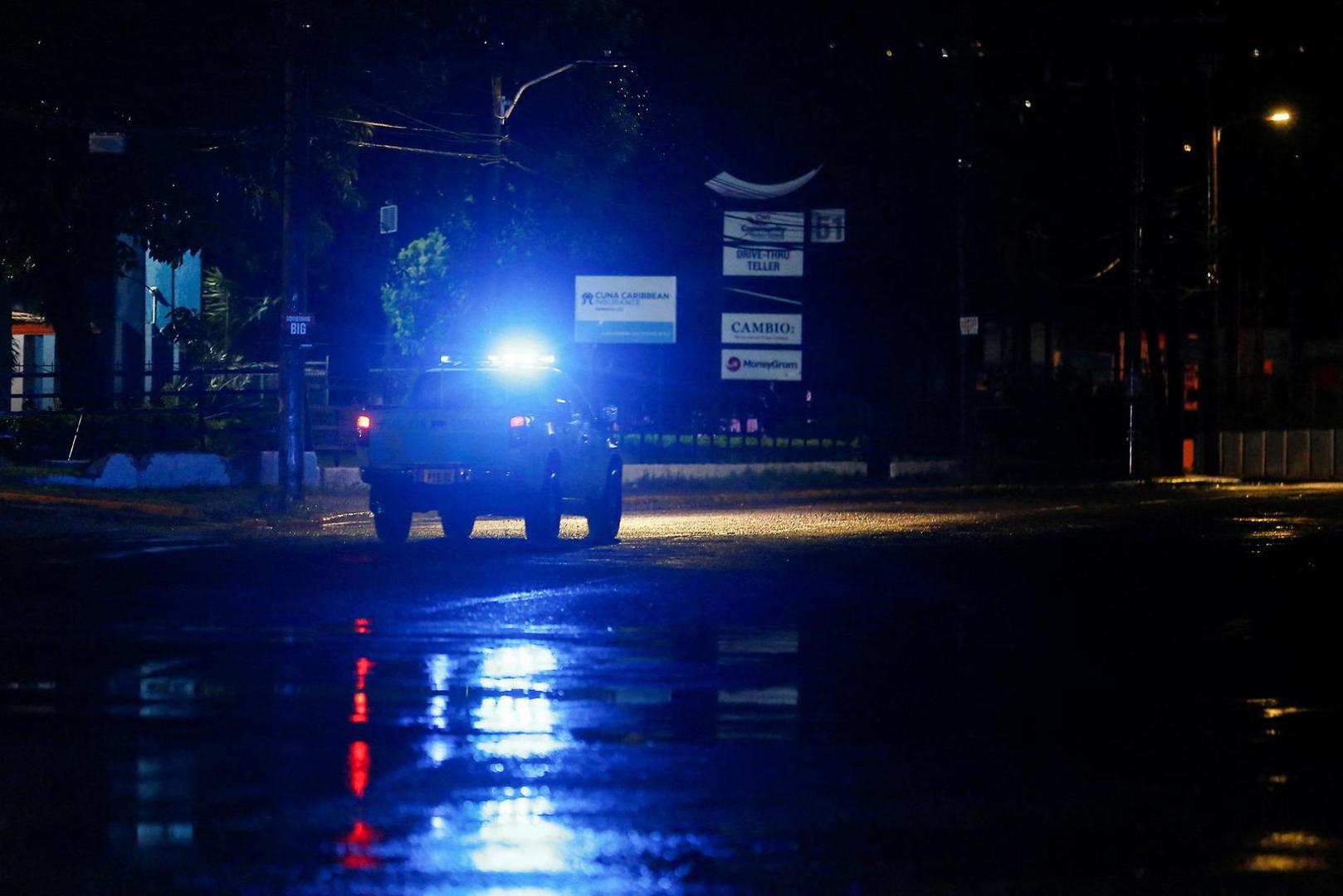 A police vehicle drives down an empty road, as Hurricane Melissa approaches, in Kingston, Jamaica, October 27, 2025.  REUTERS/Octavio Jones Photo: OCTAVIO JONES/REUTERS