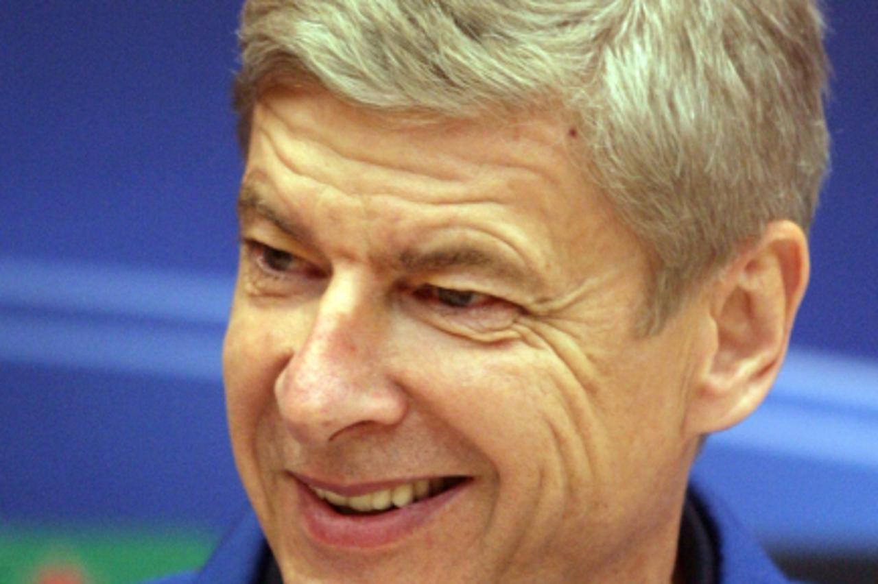 'Arsenal FC coach Arsene Wenger smiles during his press conference in Donetsk on November 2, 2010, a day before UEFA Champions League, Group H football match with FC Shakhtar. AFP PHOTO/ Alexander KHU