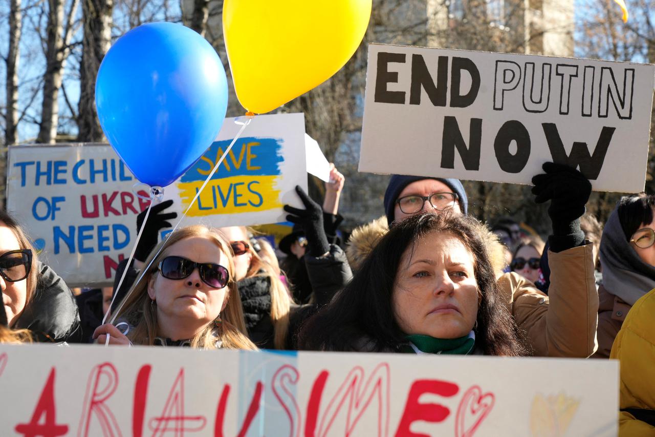 People attend women's protest in front of the Russian embassy in Vilnius