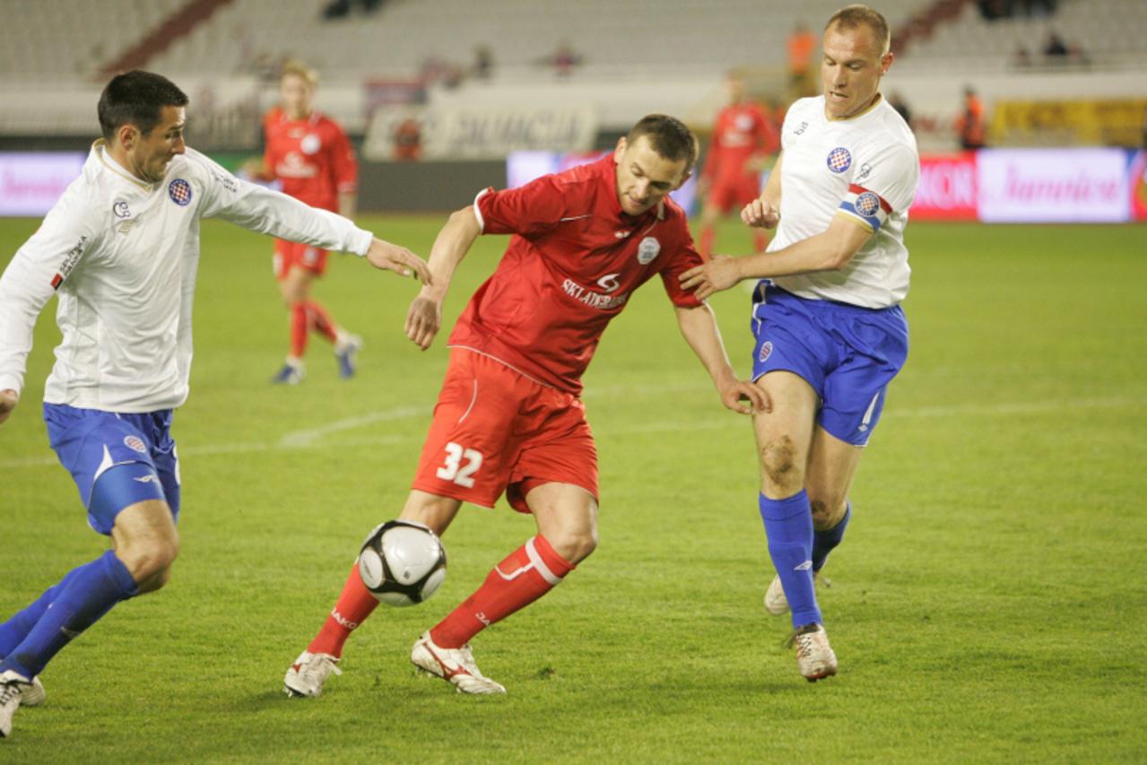 \'12.03.2011., Split - 1. HNL, nogometna utakmica 21. kola izmedju HNK Hajduk Split i RNK Split. Bojan Golubovic izmedju Andrica i Josipa Barisica. Photo: Ivo Cagalj/PIXSELL\'