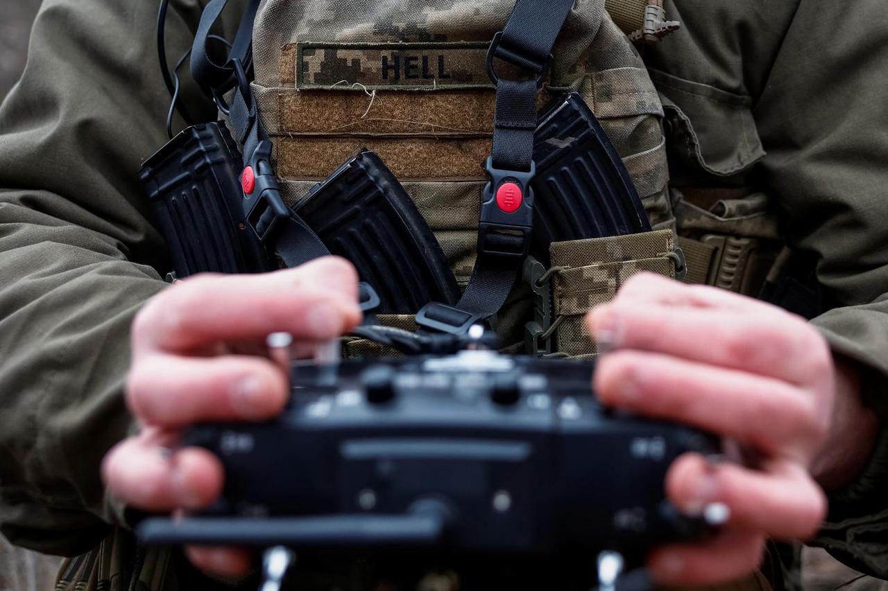 Ukrainian servicemen practice with an FPV drone, in Kharkiv region