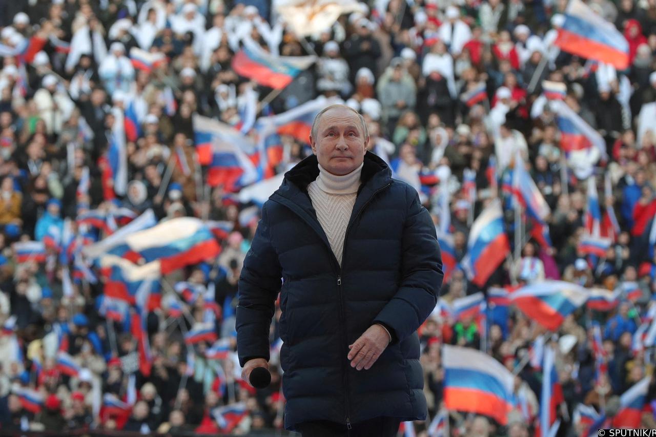 Russian President Vladimir Putin attends a concert marking the eighth anniversary of Russia's annexation of Crimea in Moscow
