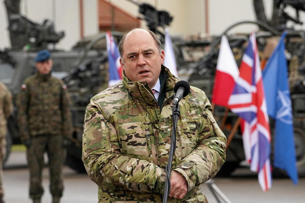 Britain's Defence Secretary Ben Wallace speaks at an army base in Bemowo Piskie