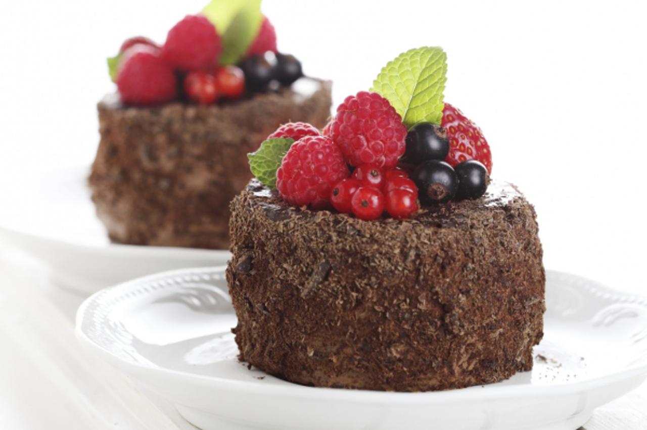 'beautiful chocolate cake with fresh berry'