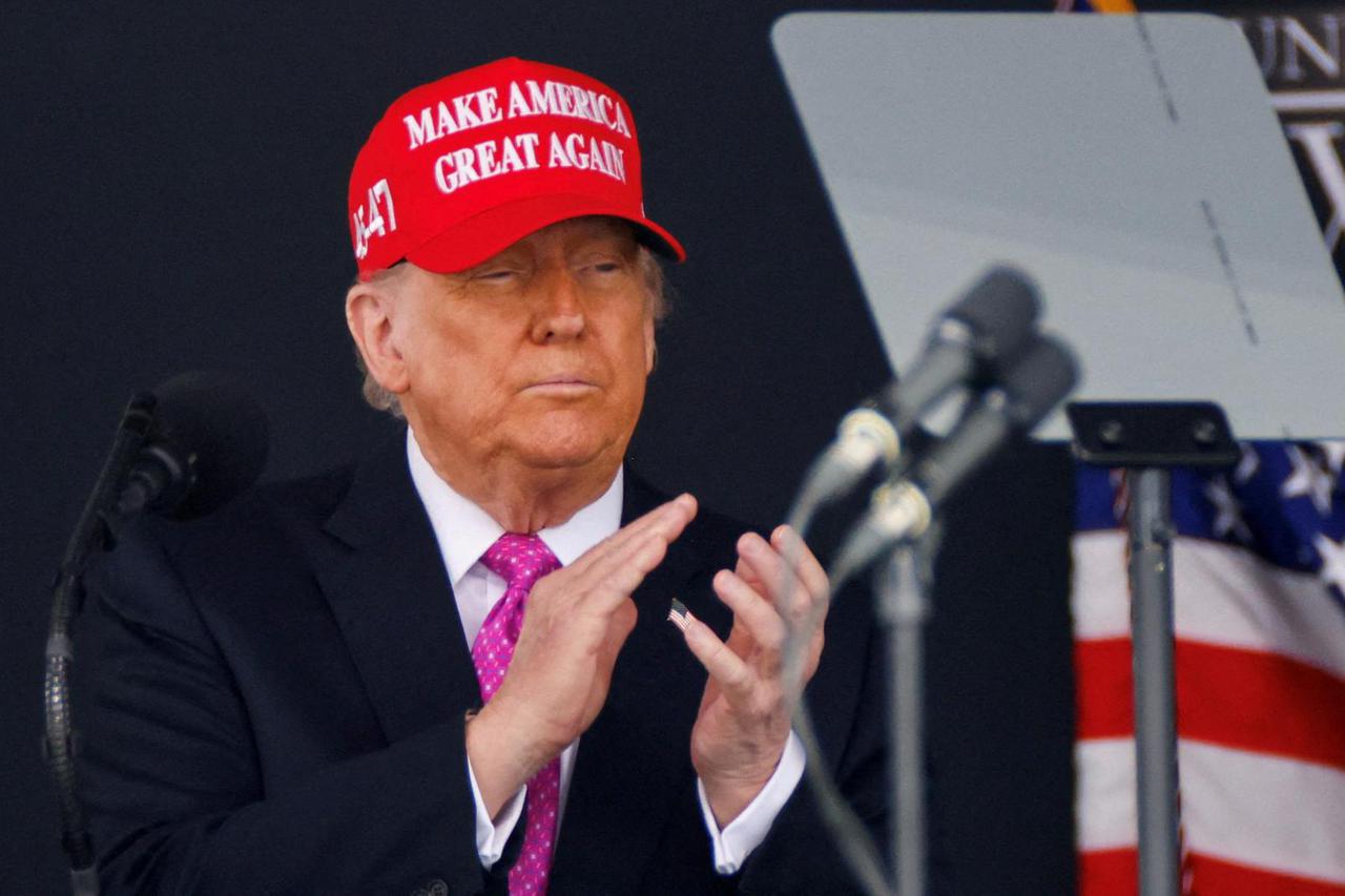 FILE PHOTO: U.S. President Donald Trump wears a 'Make America Great Again' (MAGA) hat